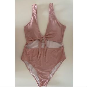 Blush one piece swimsuit with cut outs and tie